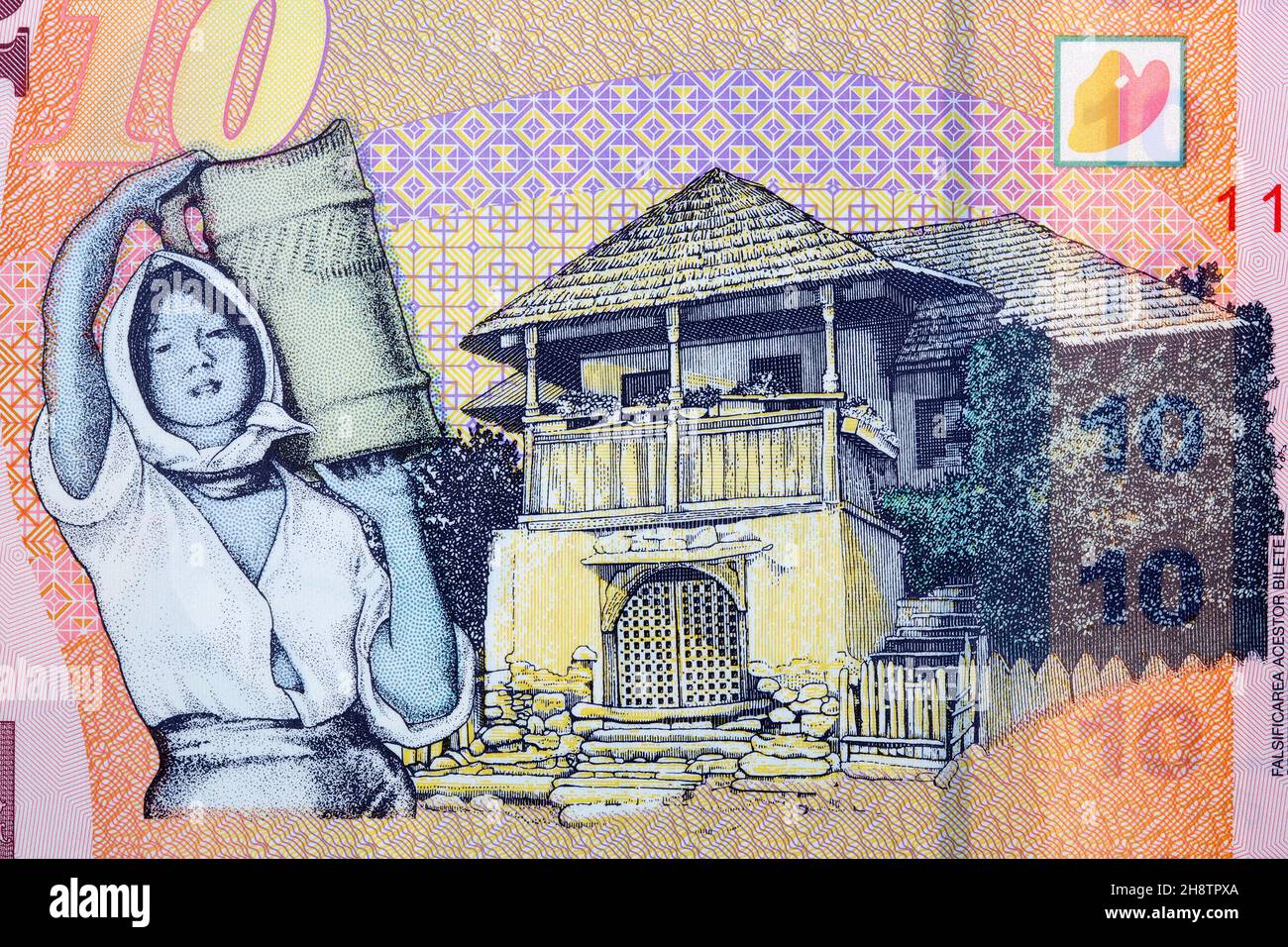 Casa tradizionale da Oltenia e donna da soldi rumeni - Leu Foto Stock