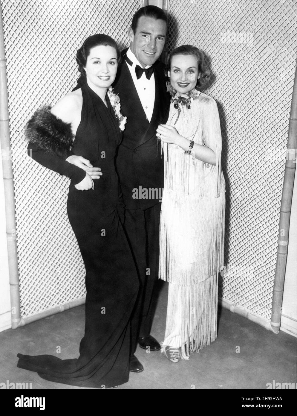 GAIL PATRICK RANDOLPH SCOTT e CAROLE LOMBARD in occasione di una festa al Brown Derby Restaurant nel febbraio 1936 Foto Stock
