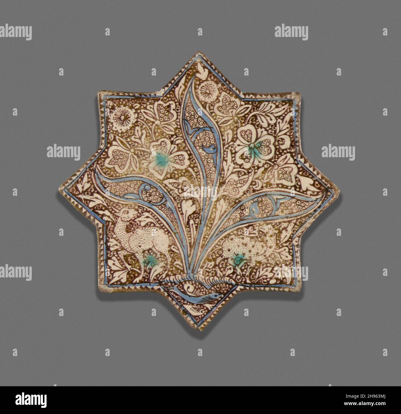 Tile a forma di stella, dinastia Ilkhanid (1256-1353), c.. 1300. Foto Stock