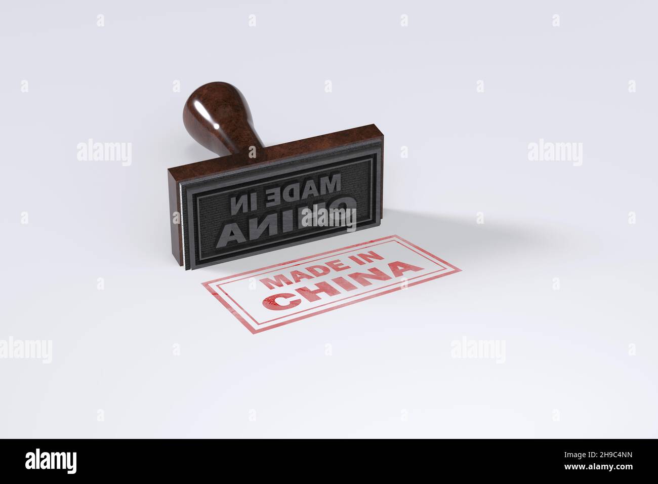 Stampaggio della gomma che dice Made in China su sfondo bianco. Foto Stock