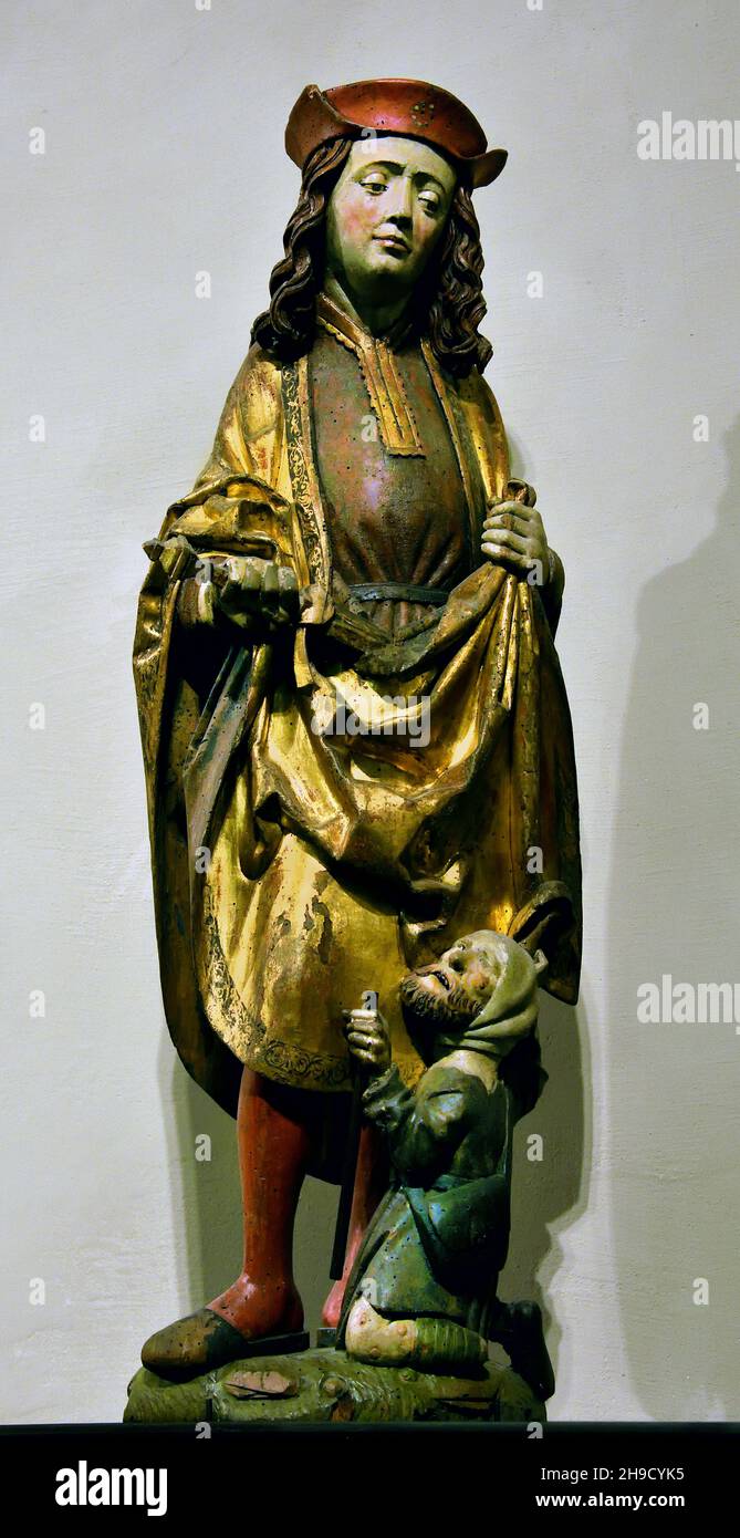 San Martino e il mendicante, 500 scultore svevo,1500. Scultore svevo (Circolo di Niklaus Weckmann) Germania tedesca Foto Stock