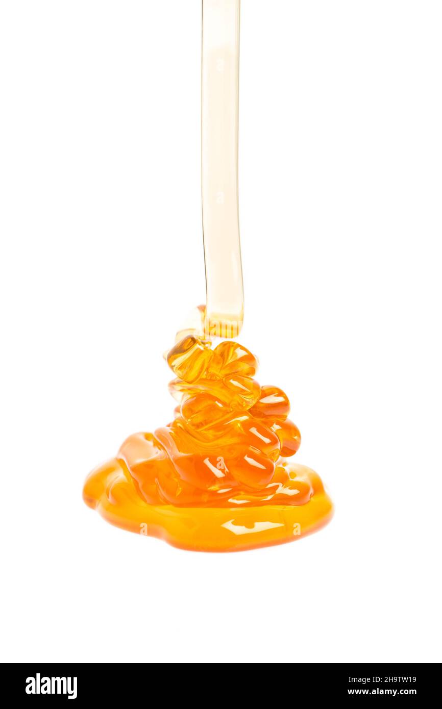 miele, bianco, fondo, liquido, giallo, fluido, correre, isolato, solo, cibo, dolce, flusso, dorato, goccia, gocce, esegui, scioglie, gocciola, tuffi, closeup Foto Stock