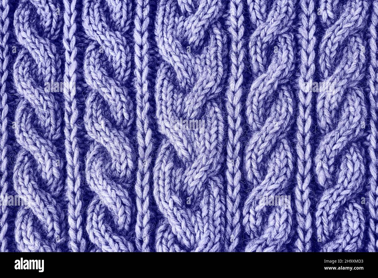 Tessuto lavorato a maglia molto peri colorato. Knitwear fatto a mano. Sfondo con texture. Colore dell'anno 2022 Foto Stock