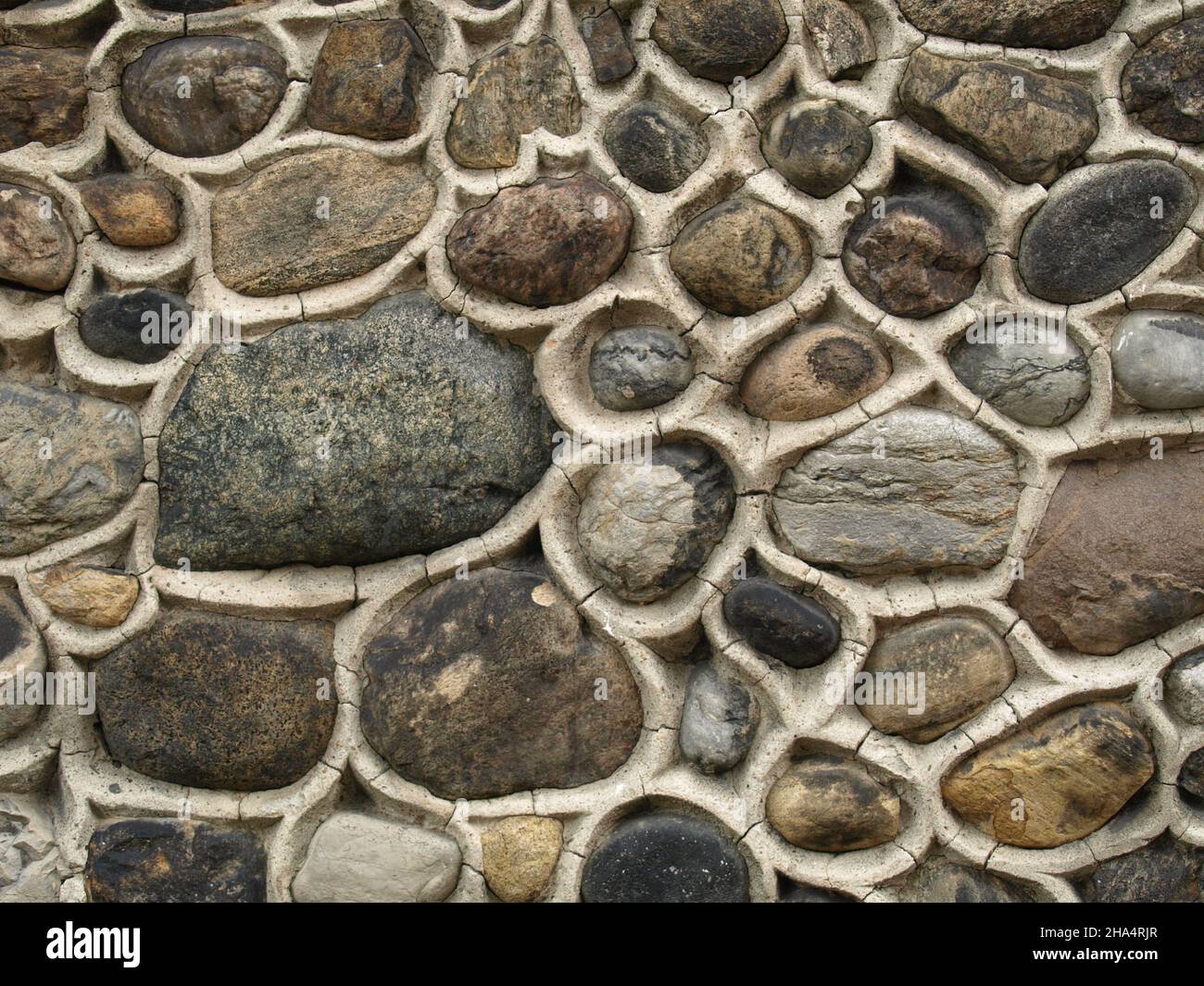 Pubblicità astratta, beige nero pietra-lavoro muro urbano muratura decorativo dinamico pattern Foto Stock