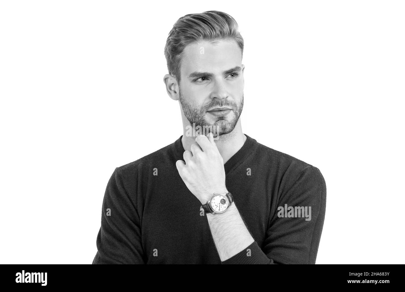 Bel ragazzo con i capelli non rasati viso look pensieroso in stile casual isolato su bianco, serio Foto Stock