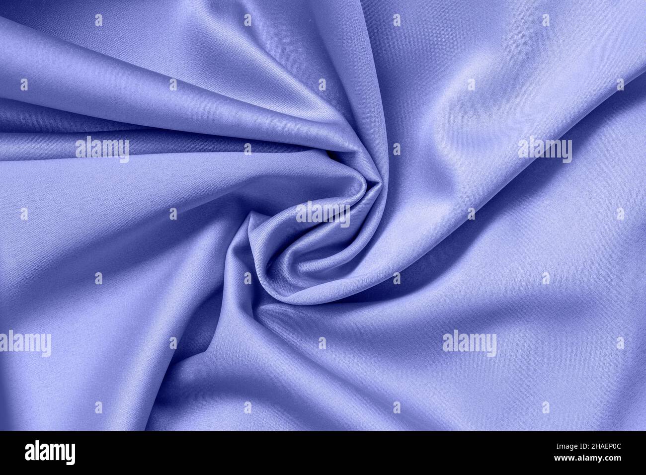 Tessuto intrecciato in morbida spirale, colore blu lavanda moda, sfondo moderno Foto Stock