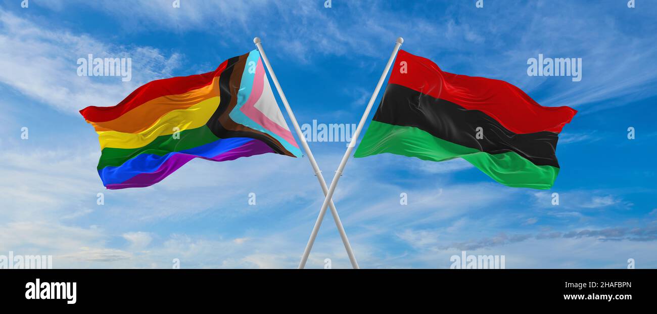 Bandiere incrociate di progresso lgbt orgoglio e bandiera panafricana ondeggiante nel vento a cielo nuvoloso. Concetto di libertà e amore. Il mese dell'orgoglio, l'attivismo, la comunità Foto Stock