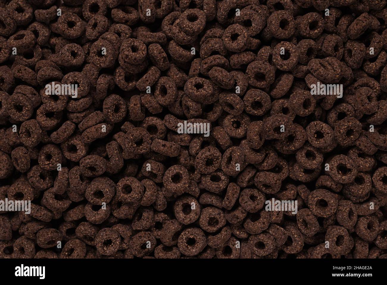 Sfondo e texture corn-flakes. Anelli di cioccolato. Foto Stock