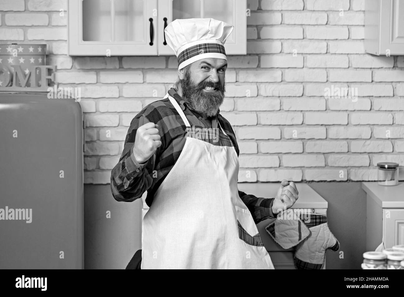 Ritratto di un cuoco felice. Cappello da cucina. Chef bearded, cuochi o panettiere. Foto Stock