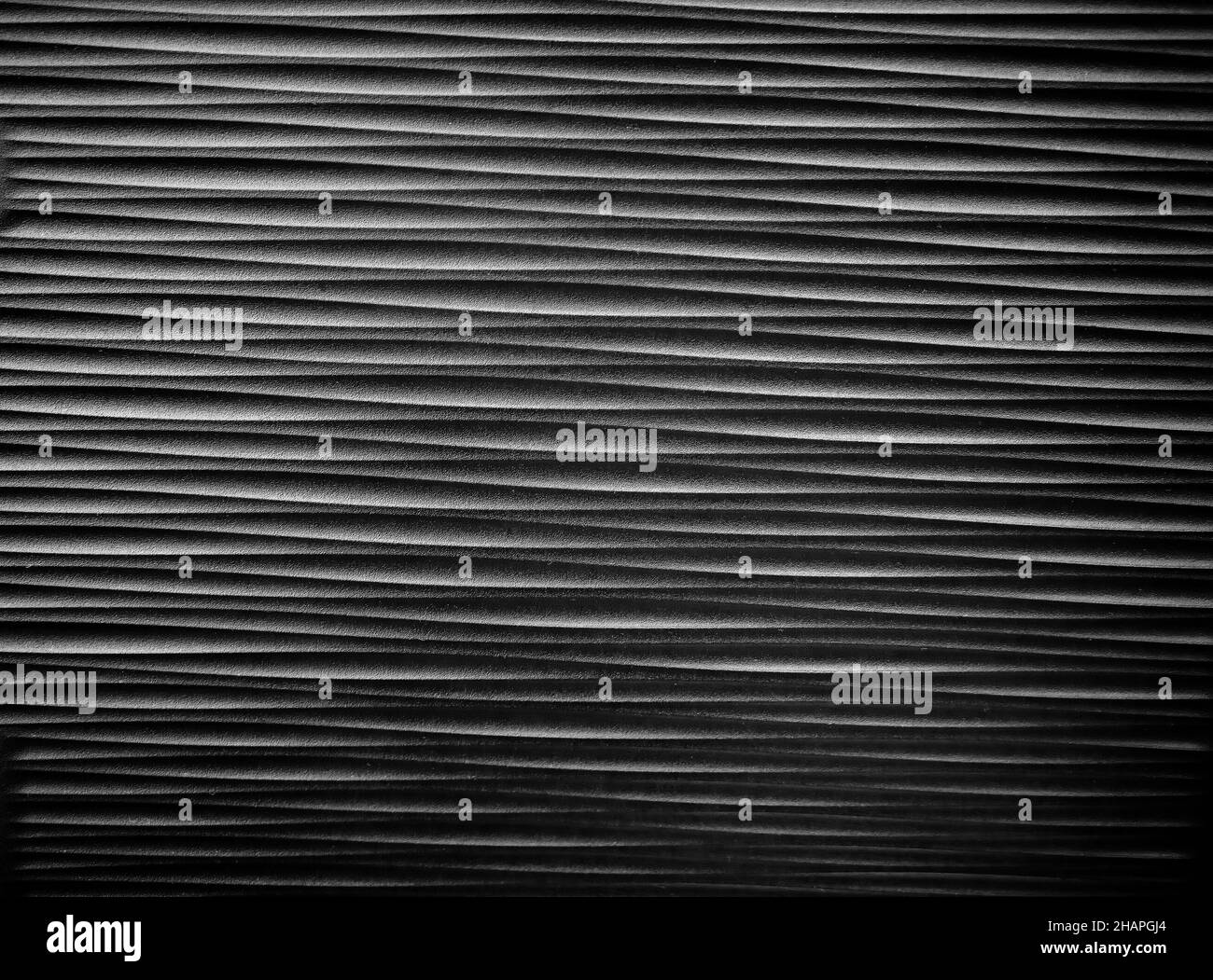 Sfondo nero con texture di forma irregolare Foto Stock