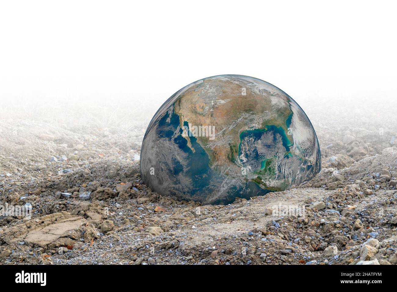 Simbolo globo terrestre caduto in ghiaia gradiente indietro Foto Stock