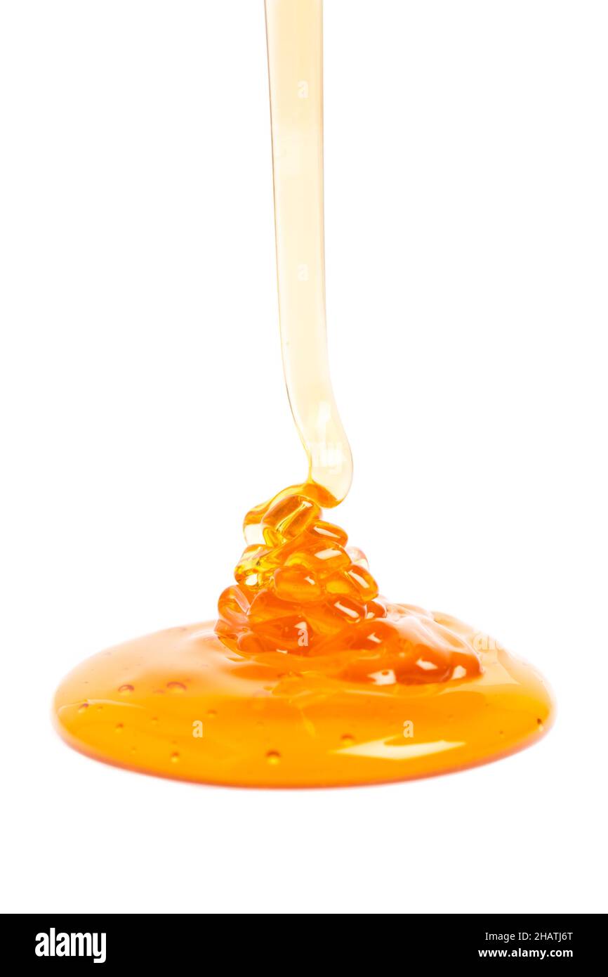 miele, trickle, goccia, molto, bianco, fluente, sfondo, dettagli, cibo, liquido, giallo, dorato, appiccicoso, naturalmente, dolce, azione, produrre, fresco, nobod Foto Stock