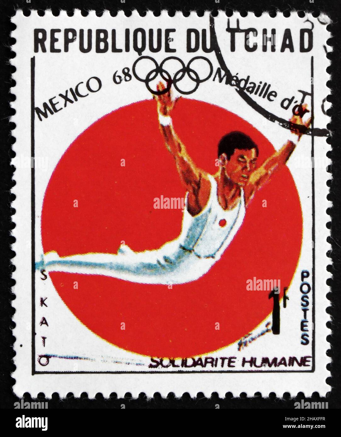 CIAD - CIRCA 1969: Un francobollo stampato in Ciad mostra Sawao Kato, All Around Gymnastics, vincitore dei Giochi Olimpici del 1968, Messico, circa 1969 Foto Stock