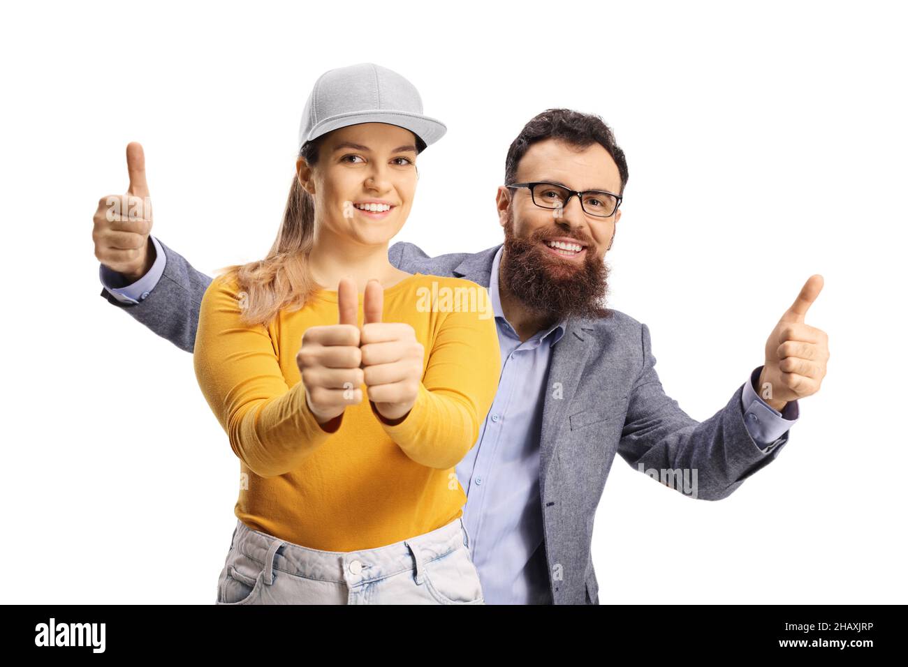 L'uomo bearded dietro una femmina giovane, entrambi i pollici di gesturing su isolati su bianco Foto Stock