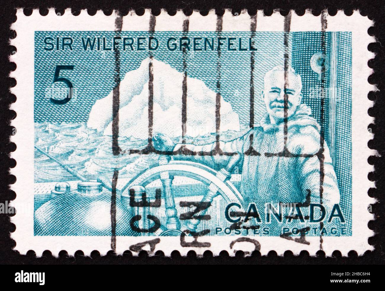 CANADA - CIRCA 1965: Un francobollo stampato in Canada mostra Sir Wilfred Grenfell alla ruota della nave dell'ospedale Strathcona II, autore, medico missionario, cir Foto Stock