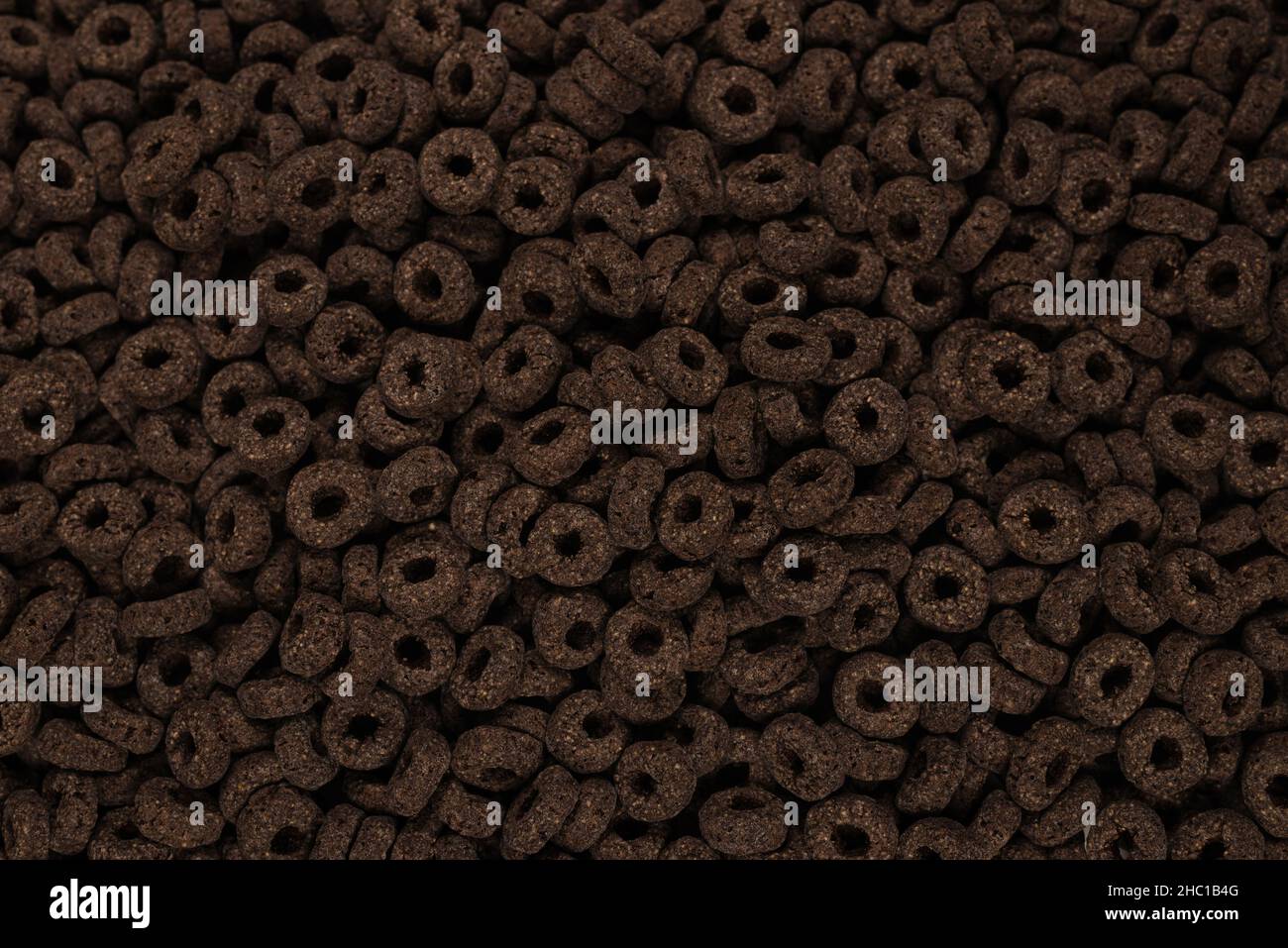 Sfondo e texture corn-flakes. Anelli di cioccolato. Foto Stock