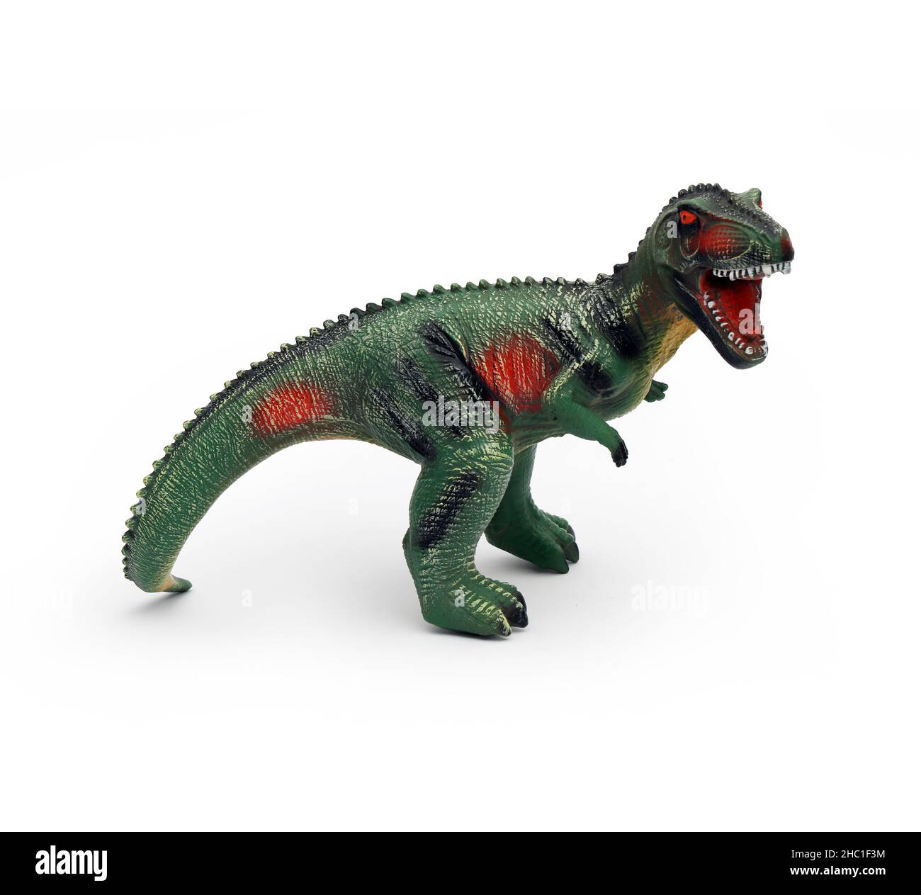 Dinosauro giocattolo isolato su sfondo bianco carta vacanza Creative minimal concept Foto Stock