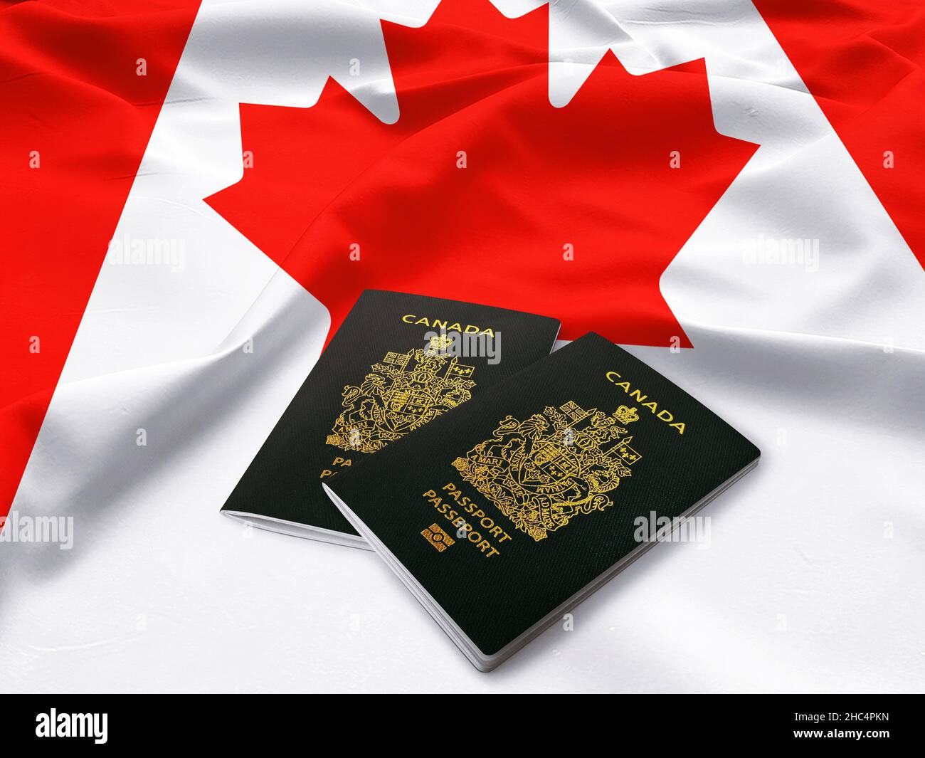 Passaporti del Canada, passaporto canadese sulla cima della bandiera di raso Foto Stock