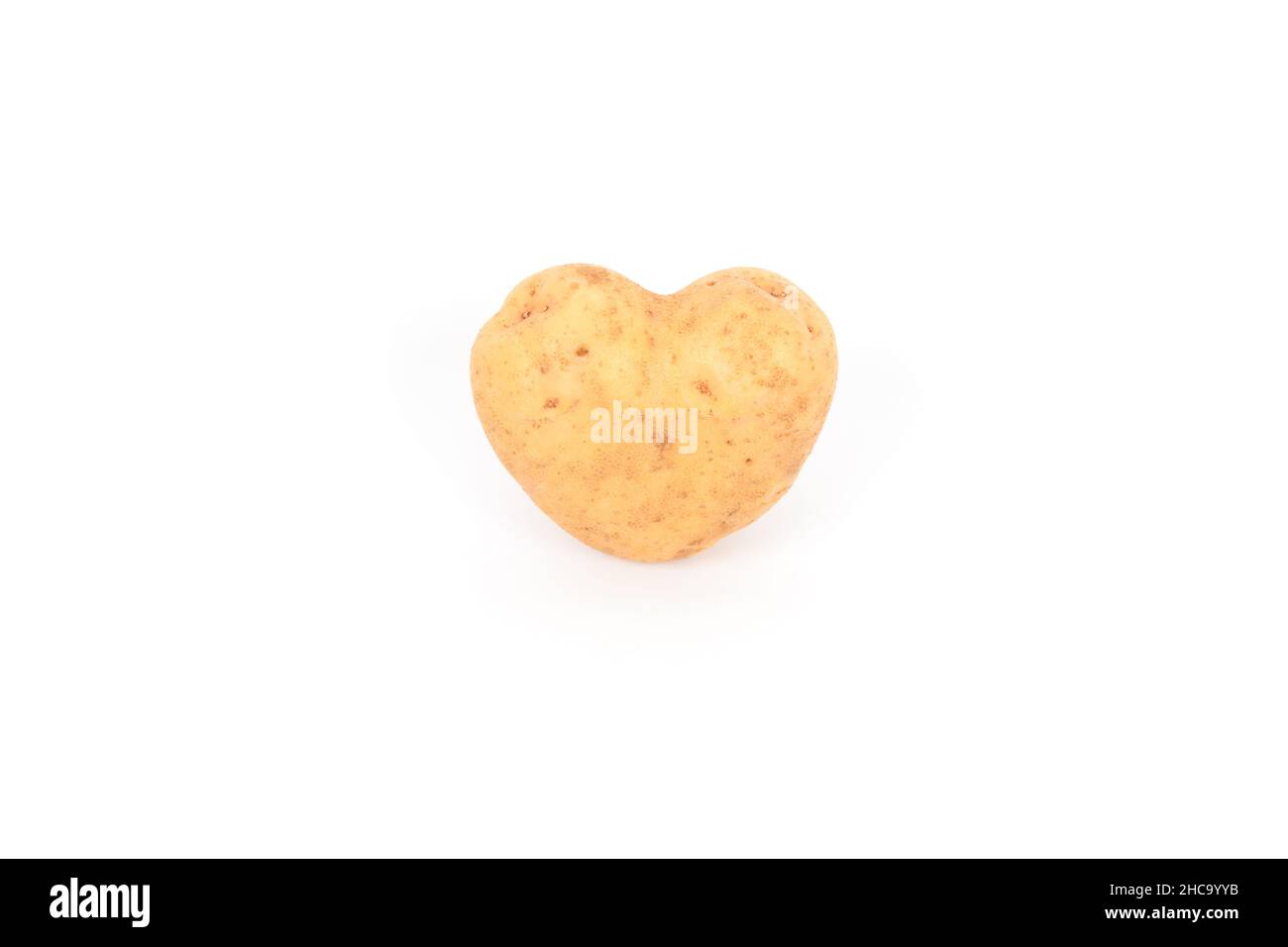 tubero di patate fresco con la forma del cuore Foto Stock