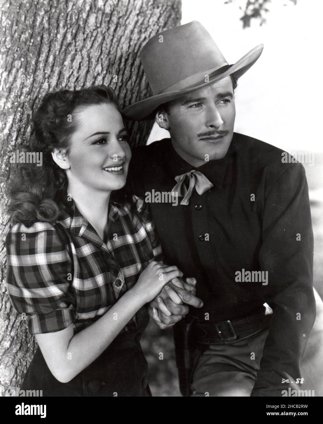 OLIVIA DE HAVILLAND e ERROL FLYNN nella CITTÀ DI DODGE (1939), diretto da MICHAEL CURTIZ. Credit: WARNER BROTHERS / Album Foto Stock