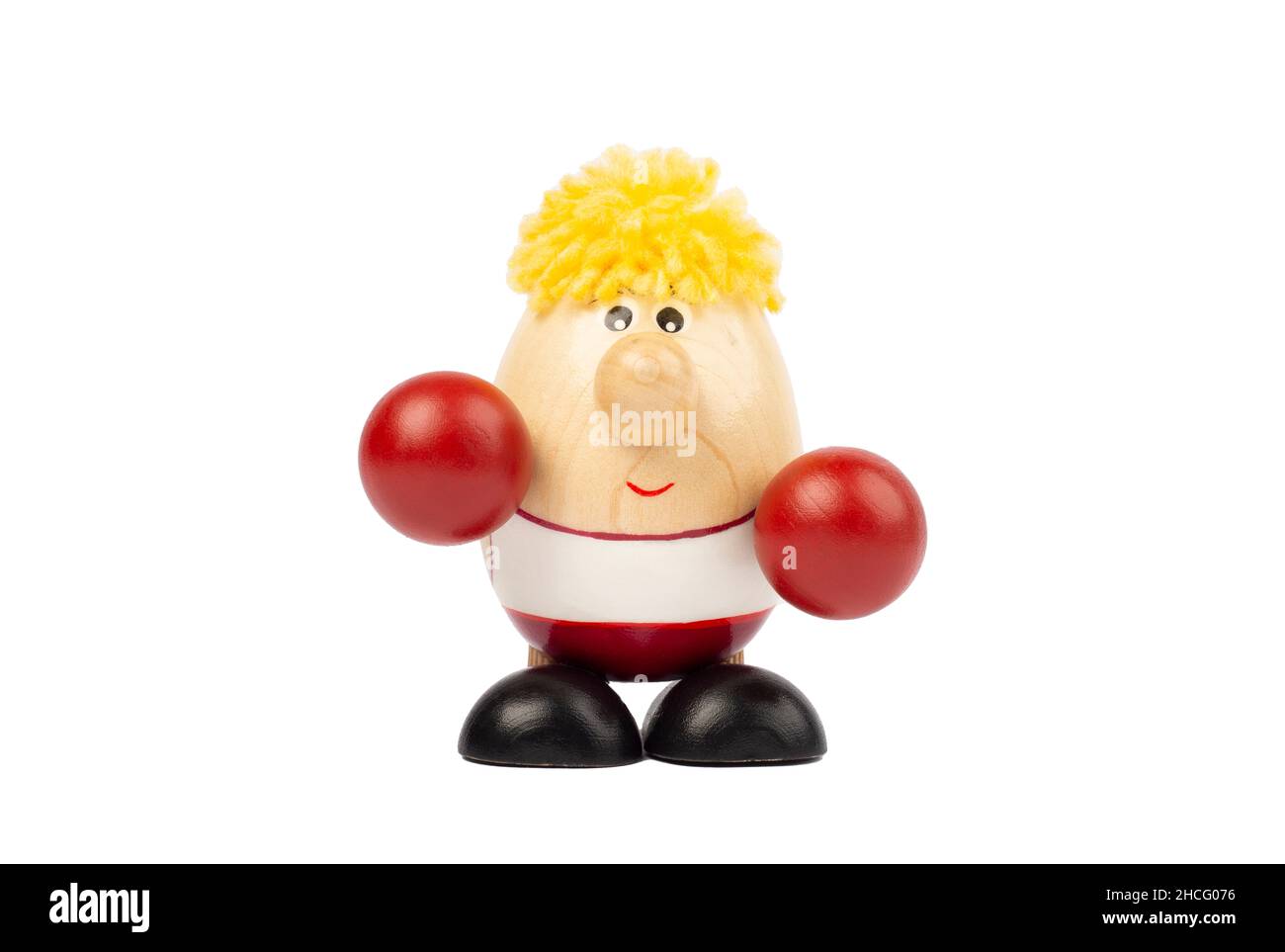 Bambola in legno a forma di uovo con guanti da boxer rossi. Foto Stock