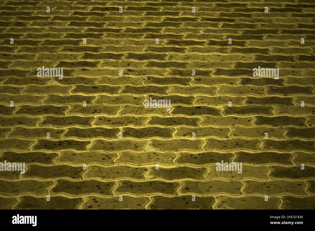 Piastrelle per pavimenti con motivo in mattoni ondulati per texture di fondo Foto Stock