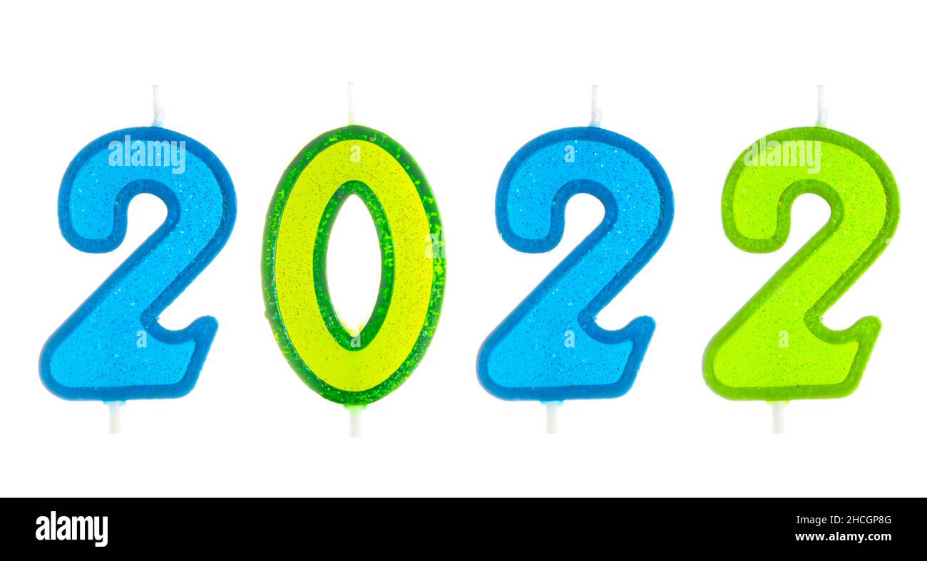 2022 felice anno nuovo che brucia candele partito isolato su bianco. Foto Stock