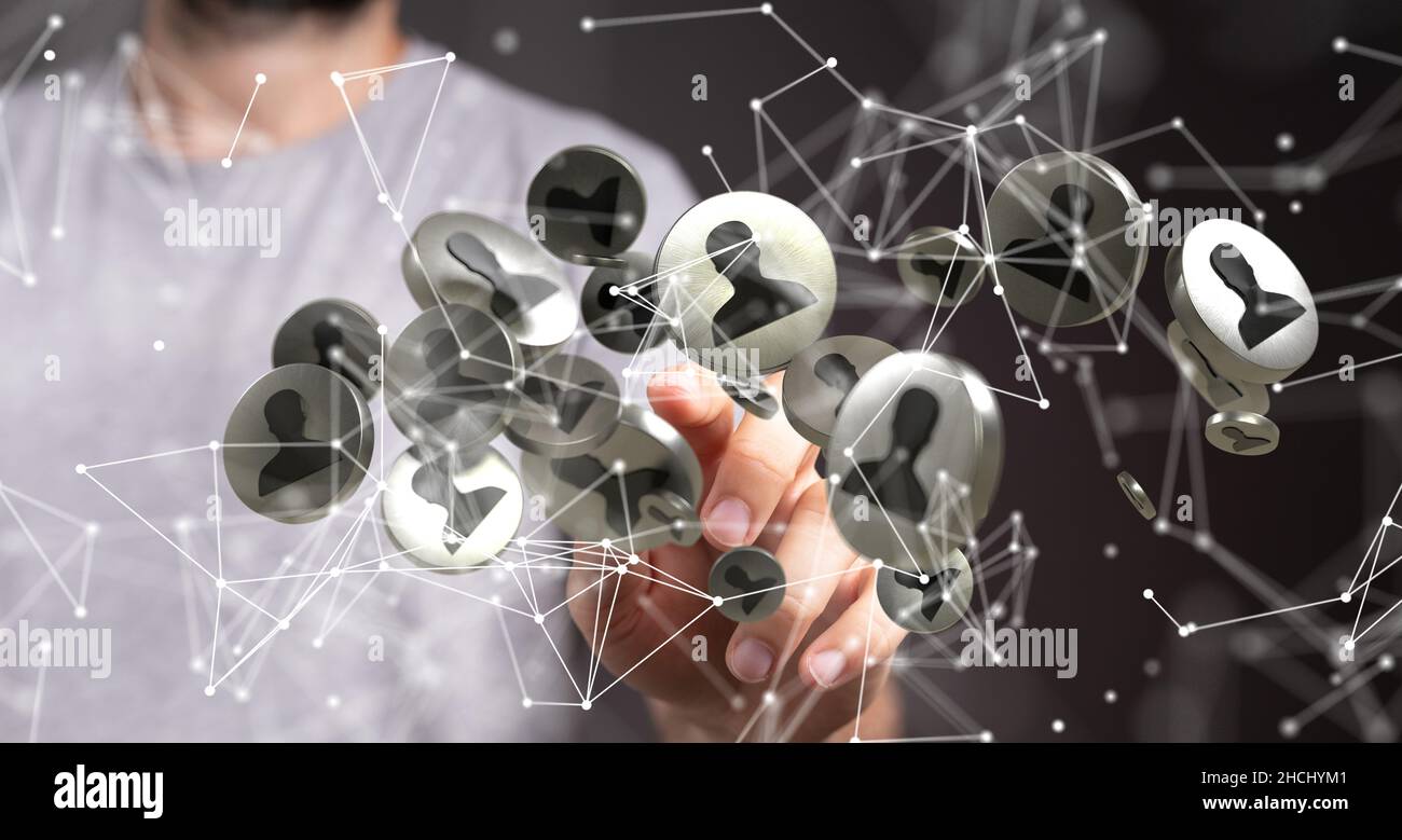 E le comunicazioni di sfondo tematico con icone digitali fluttuanti davanti alle mani Foto Stock