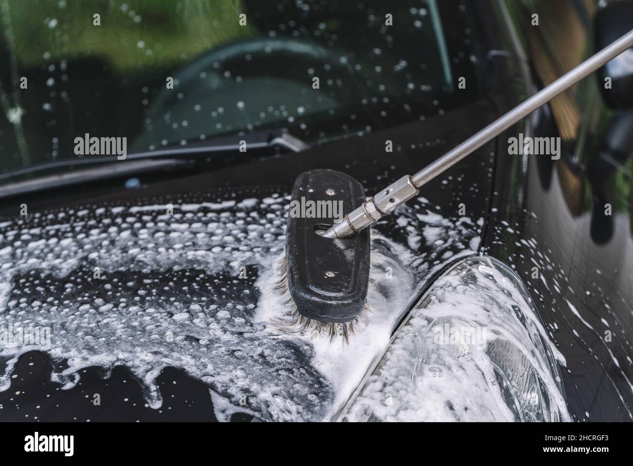 Immagine di lavaggio e dettagli dell'auto. Prendere l'auto di un'automobile. Foto Stock