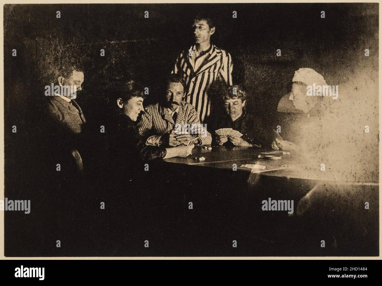 Robert Louis Stevenson gioca le carte con la famiglia e gli amici Foto Stock