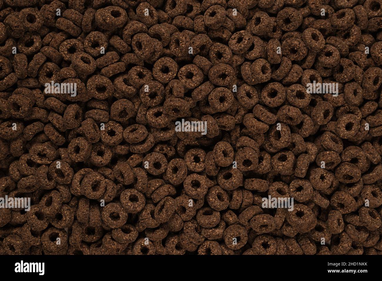 Sfondo e texture corn-flakes. Anelli di cioccolato. Foto Stock