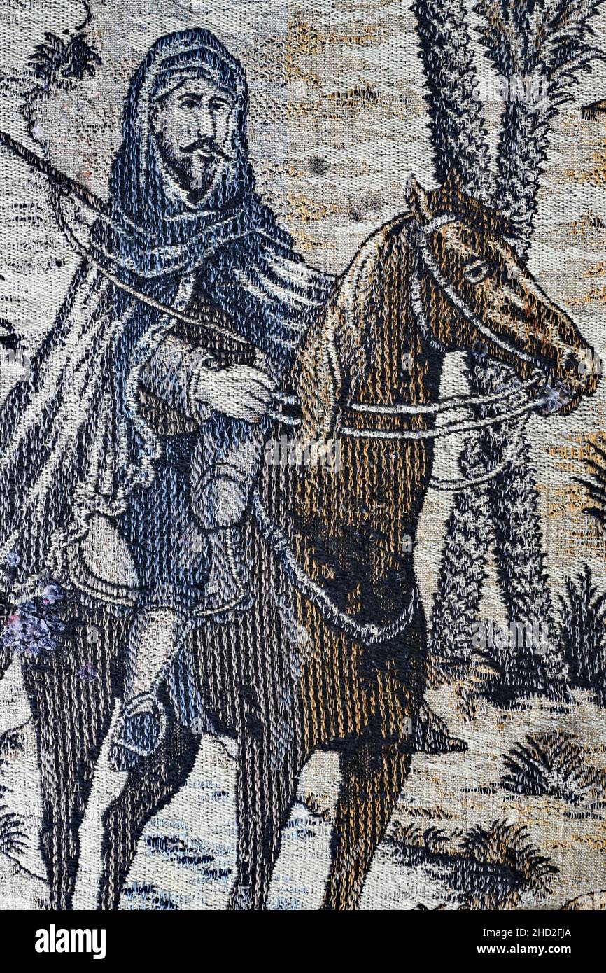 Cavaliere orientale con fucile su una coperta in tessuto Art Deco Foto Stock