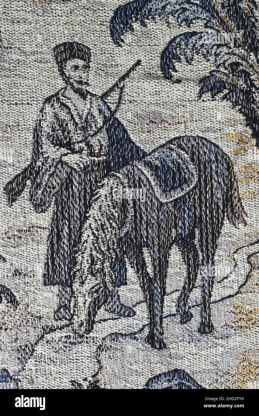 Cavaliere orientale con fucile su una coperta in tessuto Art Deco Foto Stock