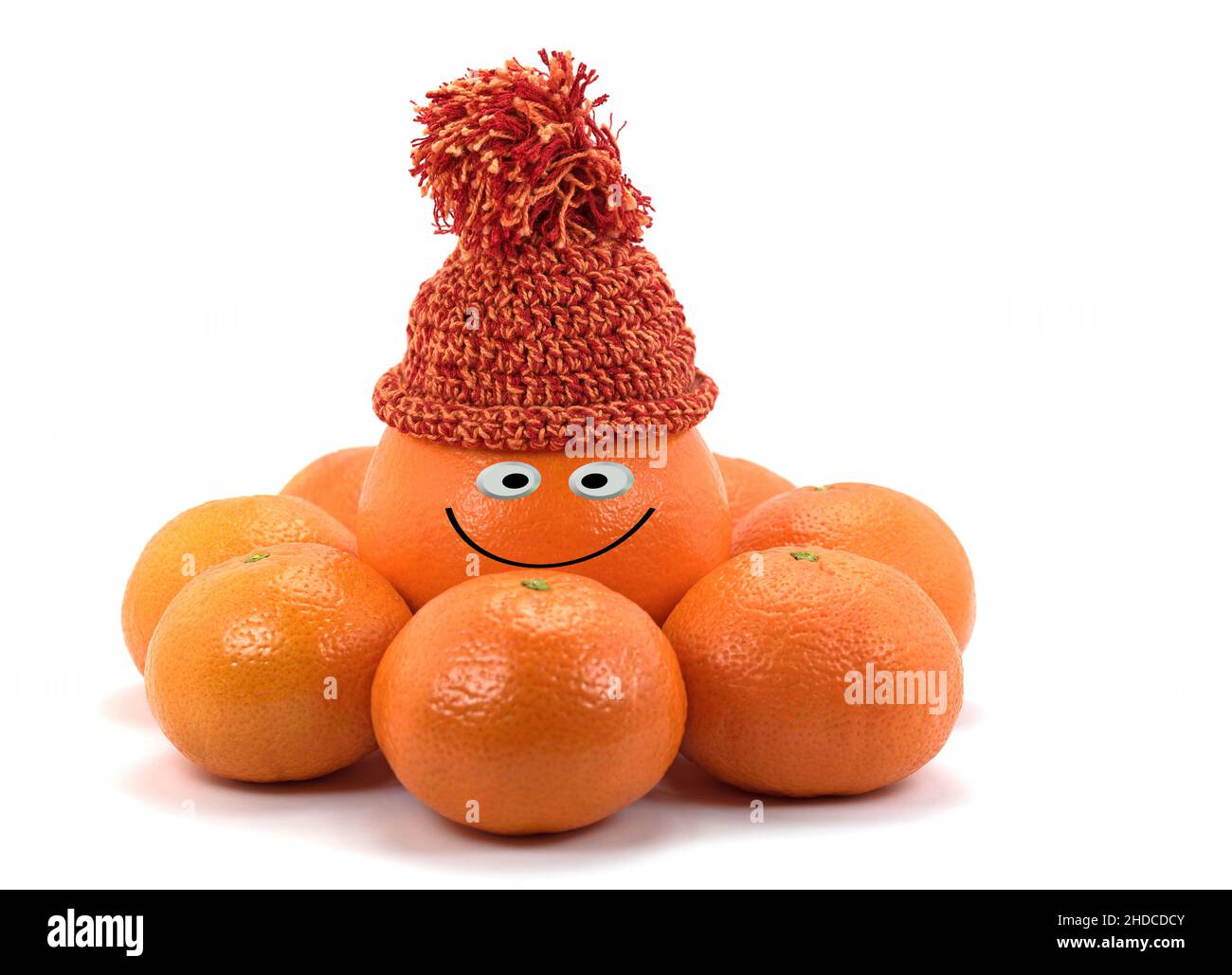Arancio con volto felice e tangerini Foto Stock