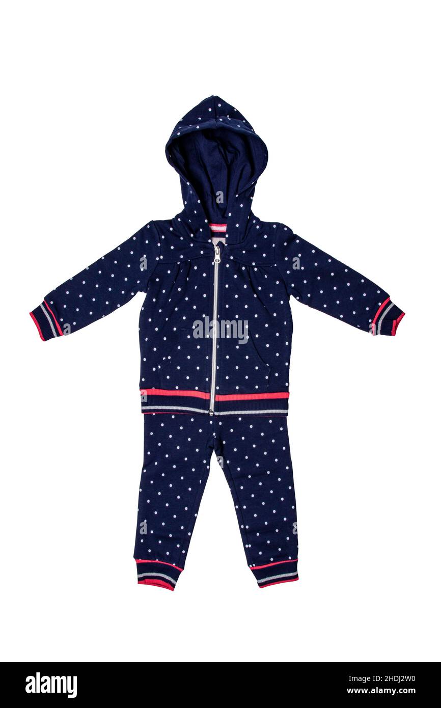 Primo piano di un elegante pullover con cappuccio blu scuro e alla moda con puntini di polka e un paio di pantaloni denim per la bambina. Pantaloni sportivi per bambini e giacca wi Foto Stock