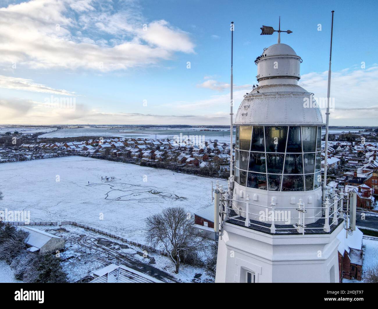Scena della neve sul faro Foto Stock