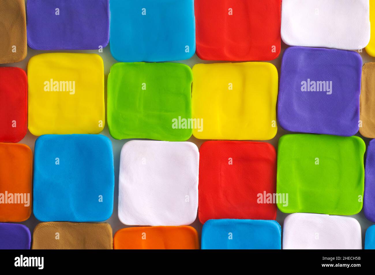 Un colorato polimero argilla quadrato sfondo Foto Stock