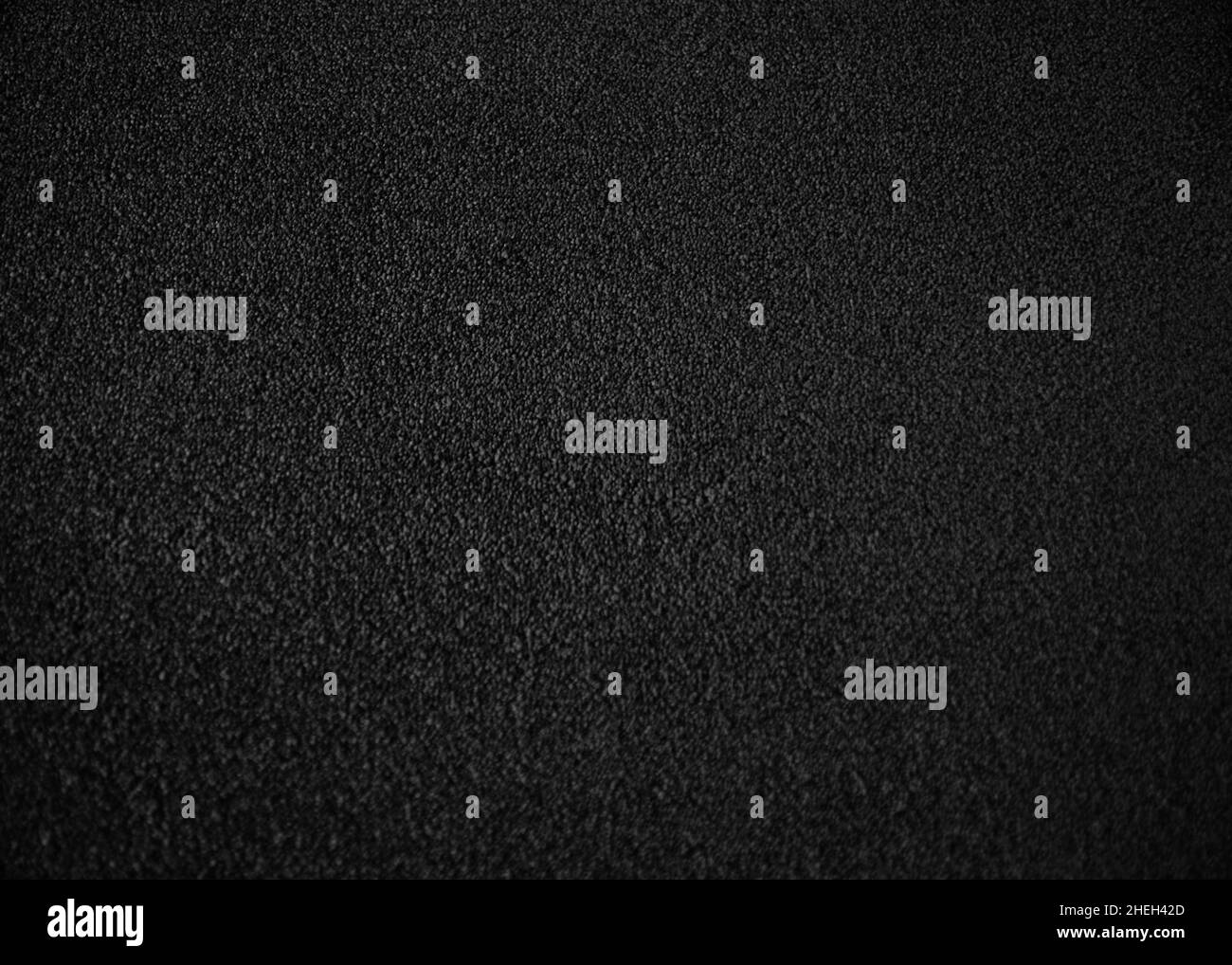 Tappeto nero per ufficio. Sfondo in tessuto di lana monocromatico senza cuciture ad alta risoluzione. Vista dall'alto del materiale interno. Pile corte Foto Stock