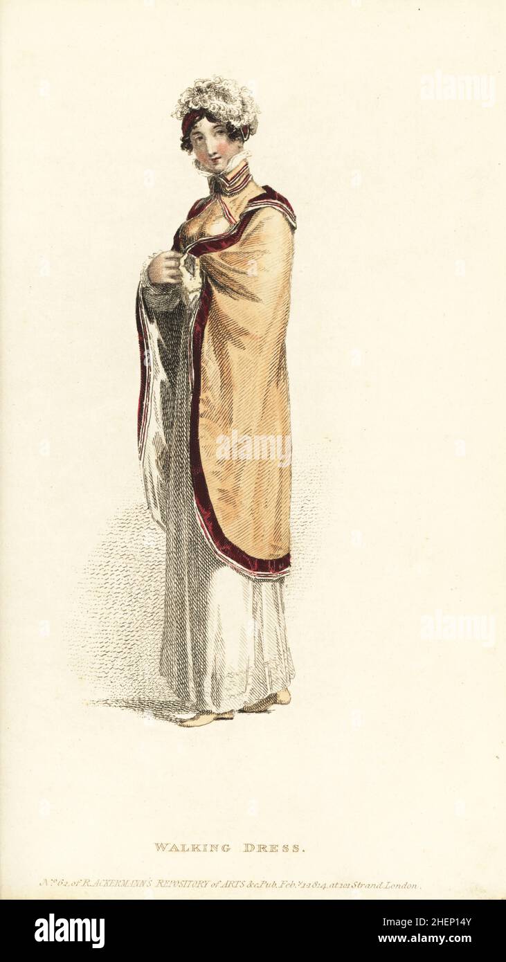 Donna reggenza in abito Promenade. Abito rotondo alto di mambrano fine, mantello russo di colore salmone pallido, bordato con velluto morone e cordoncino di seta bianco, cordoncino spencer, piccolo casco con piume struzzo, semi stivali, guanti da bambino limone. Targa 12, Vol. 10, 1 febbraio 1814. Incisione su copperplate a mano dal Rudolph Ackermann's Repository of Arts, Londra. Foto Stock