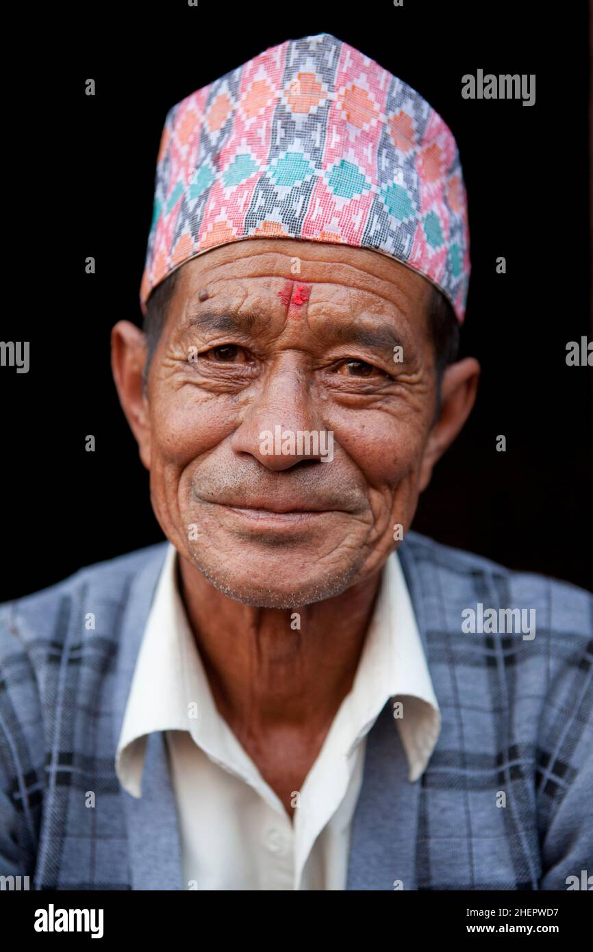 Un volto nella folla durante il Sindoor Jatra (Vermillion Festival) - parte del nuovo anno nepalese (Bisket Jatra) a Bhaktapur. Foto Stock