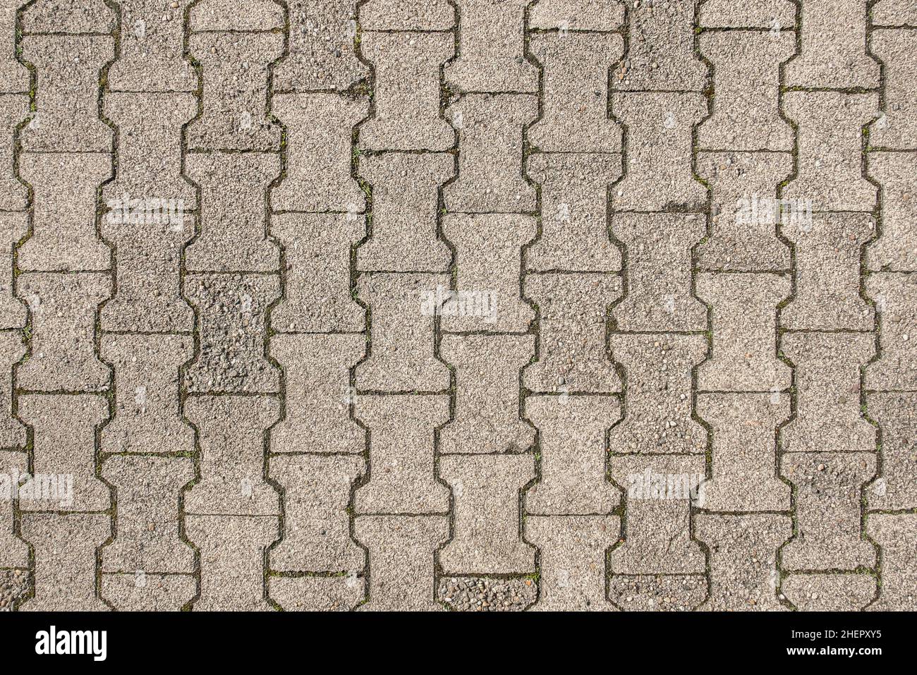 dettaglio di pietre di pavimento grigie in una strada, paveway o parcheggio Foto Stock