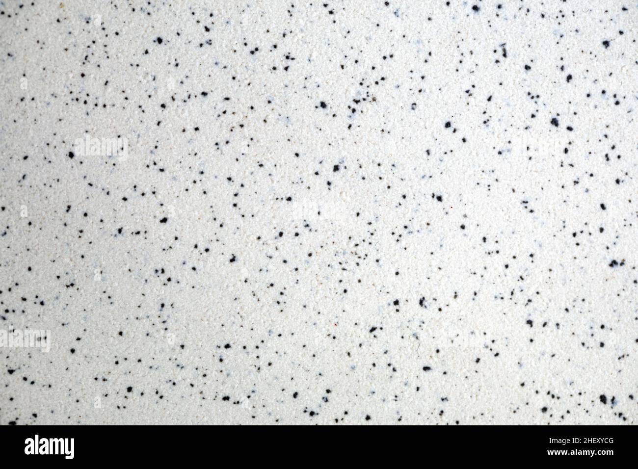 parete in cemento di marmo bianco con trama a macchie nere Foto Stock