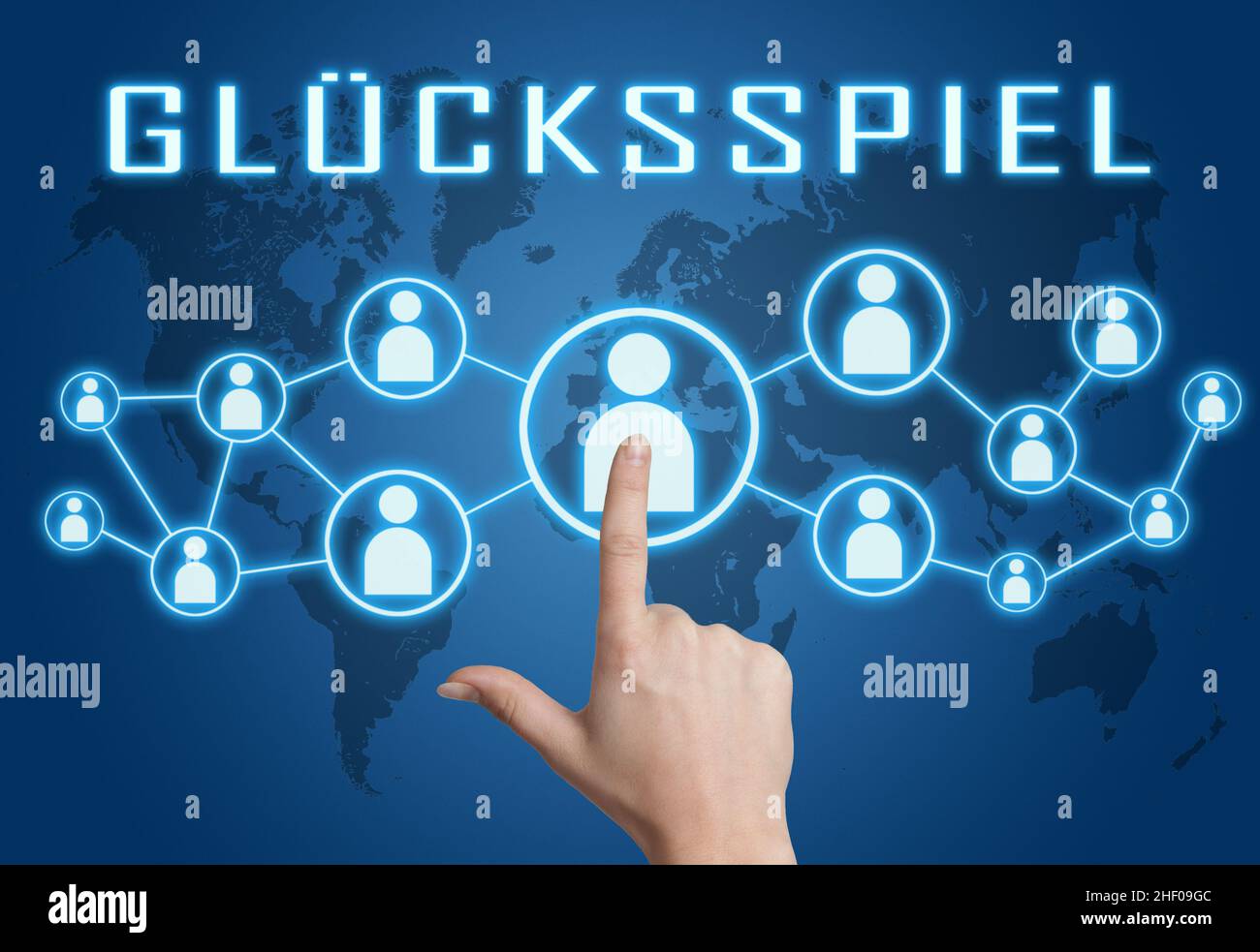 Gluecksspiel - parola tedesca per il gioco d'azzardo o il gioco d'azzardo - testo concetto con la mano premendo icone sociali su sfondo blu mappa del mondo. Foto Stock