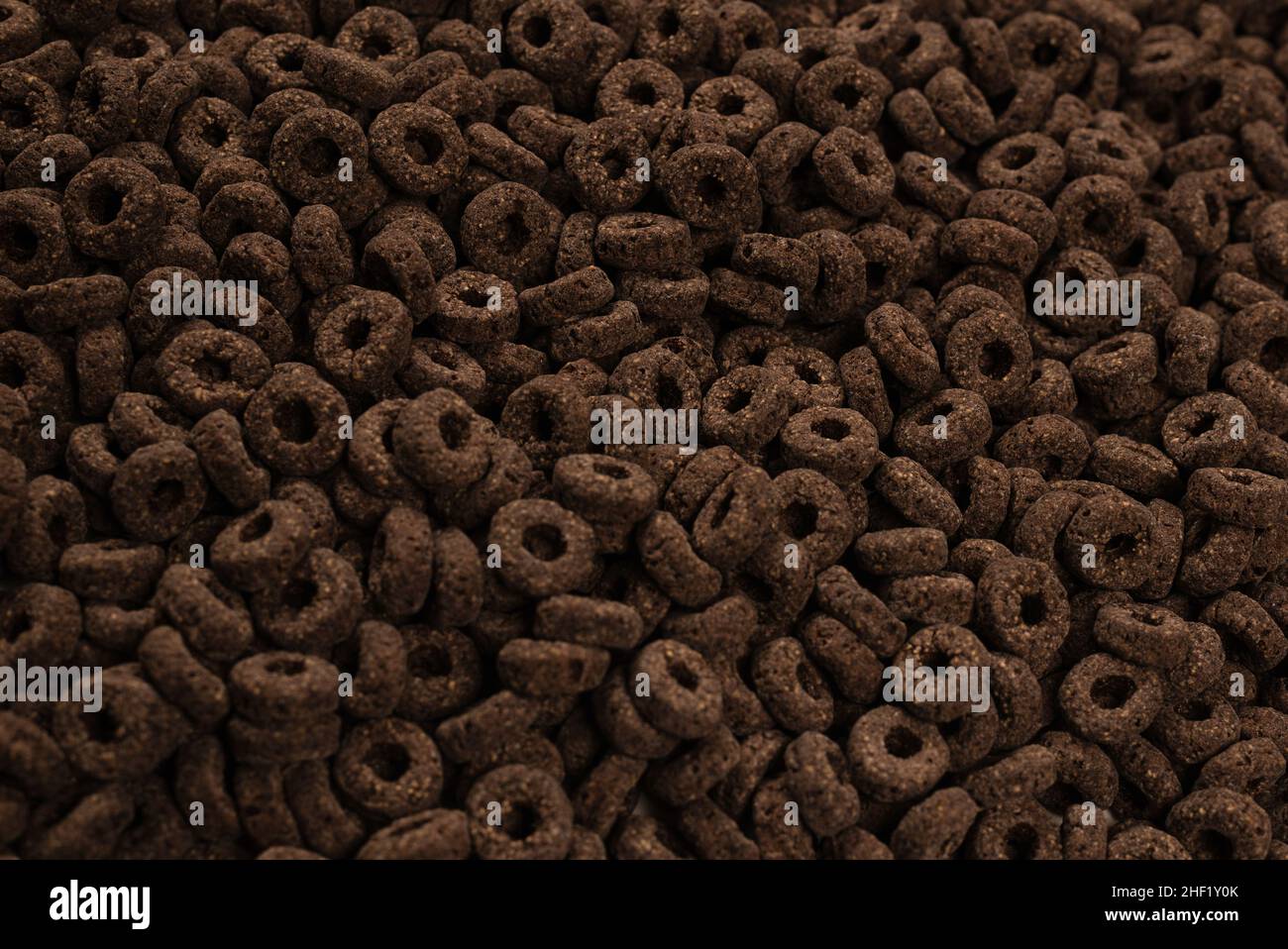 Sfondo e texture corn-flakes. Anelli di cioccolato. Foto Stock