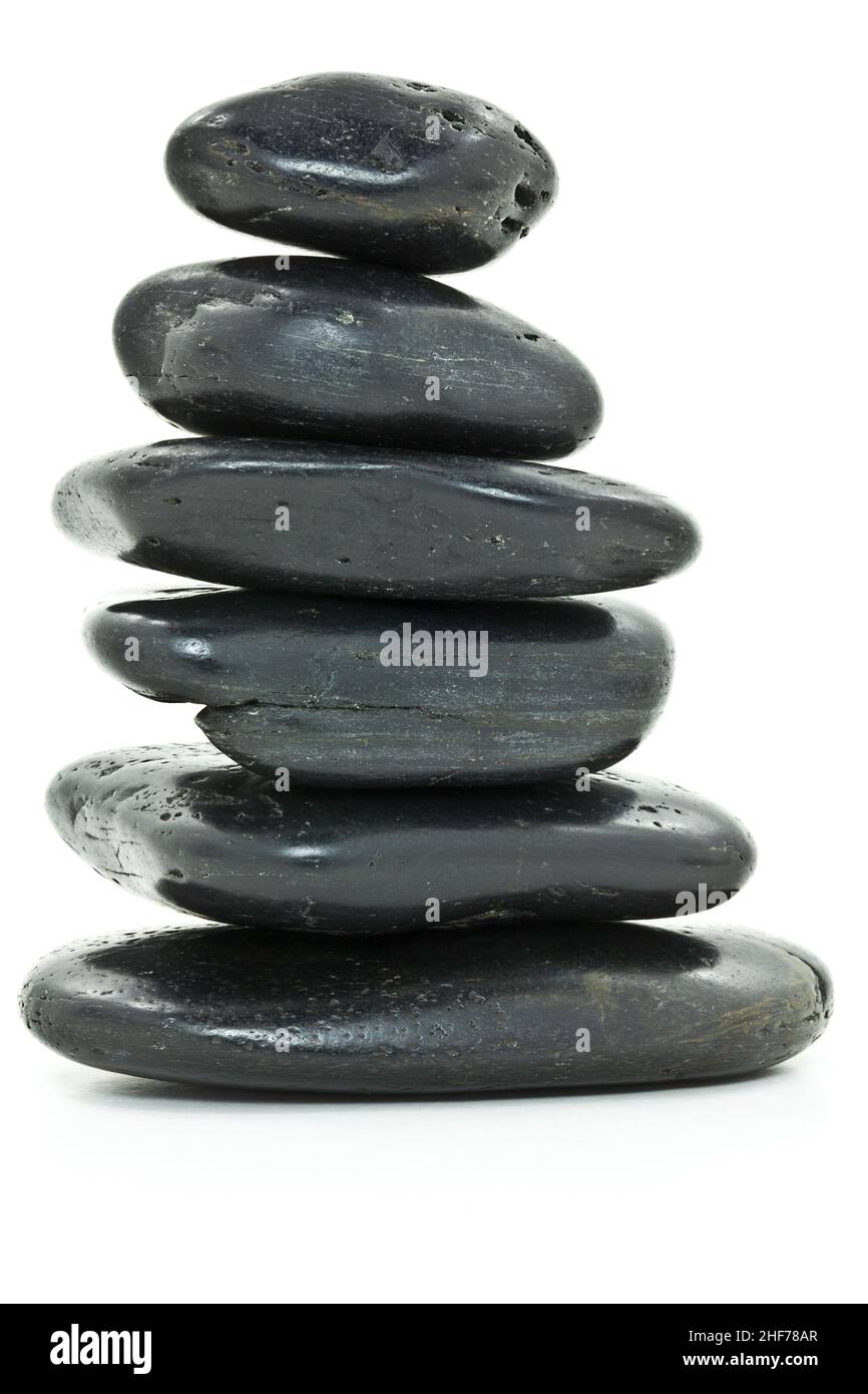 Un mucchio di pietre lisce che significano equilibrio. Foto Stock
