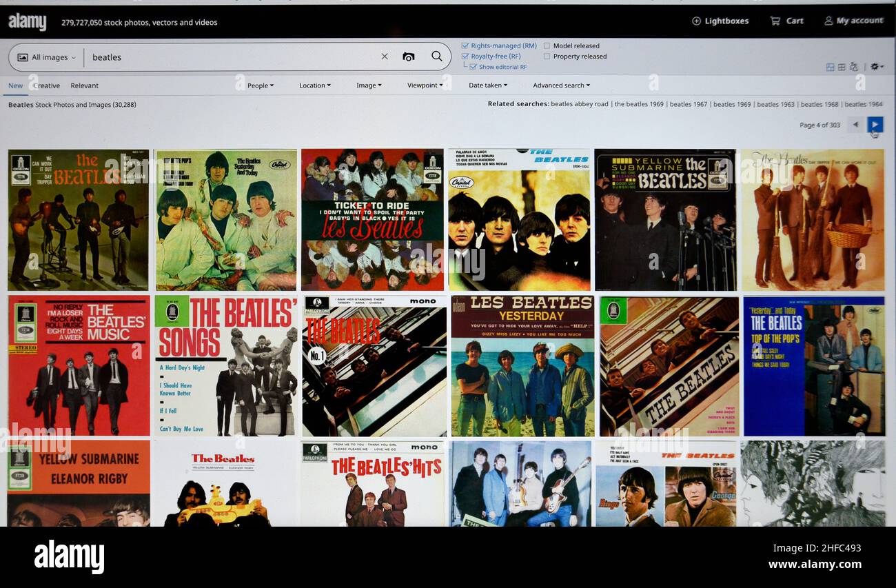 Screenshot del computer del Alamy.com che mostra le fotografie dei Beatles disponibili per l'acquisto tramite l'agenzia fotografica di riserva Alamy a Londra, Inghilterra. Foto Stock