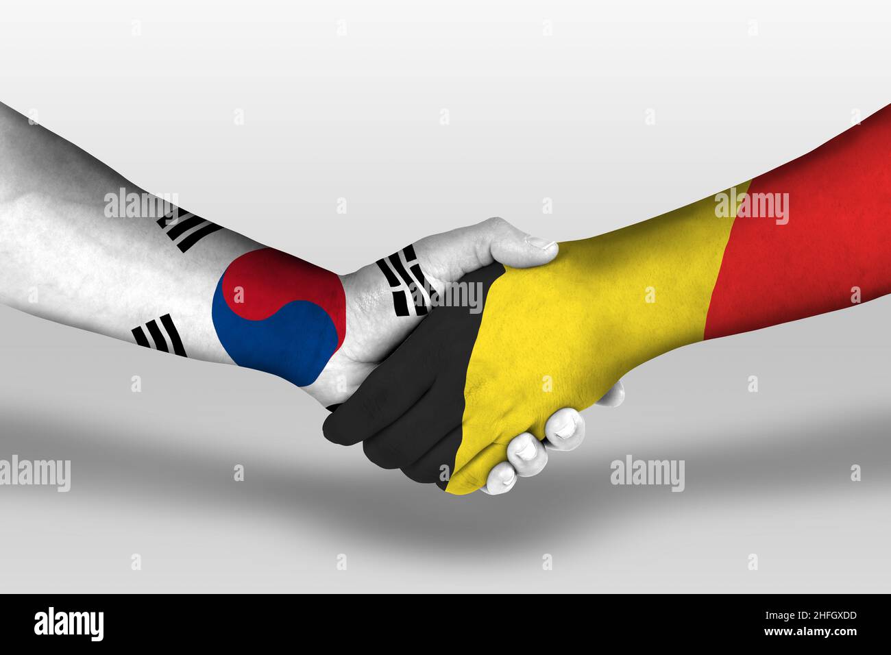 Handshake tra Australia e Corea del Sud bandiere dipinte sulle mani, illustrazione con tracciato di clipping. Foto Stock