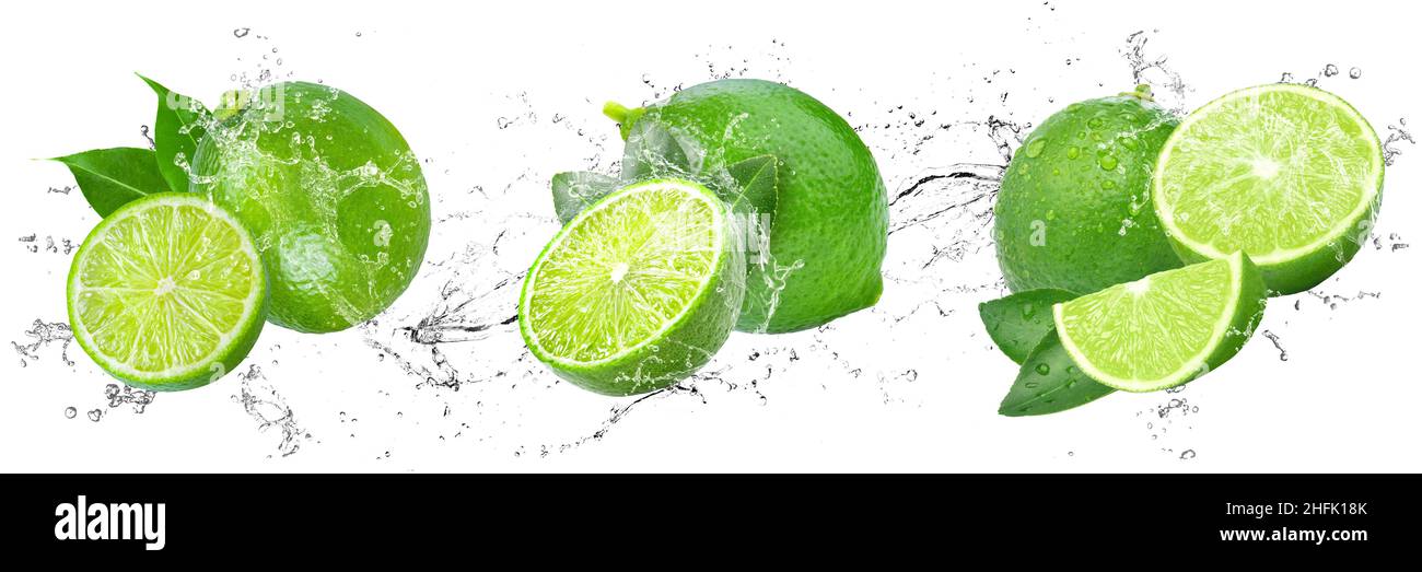 Limes fresco con spruzzi d'acqua su fondo bianco isolato Foto Stock