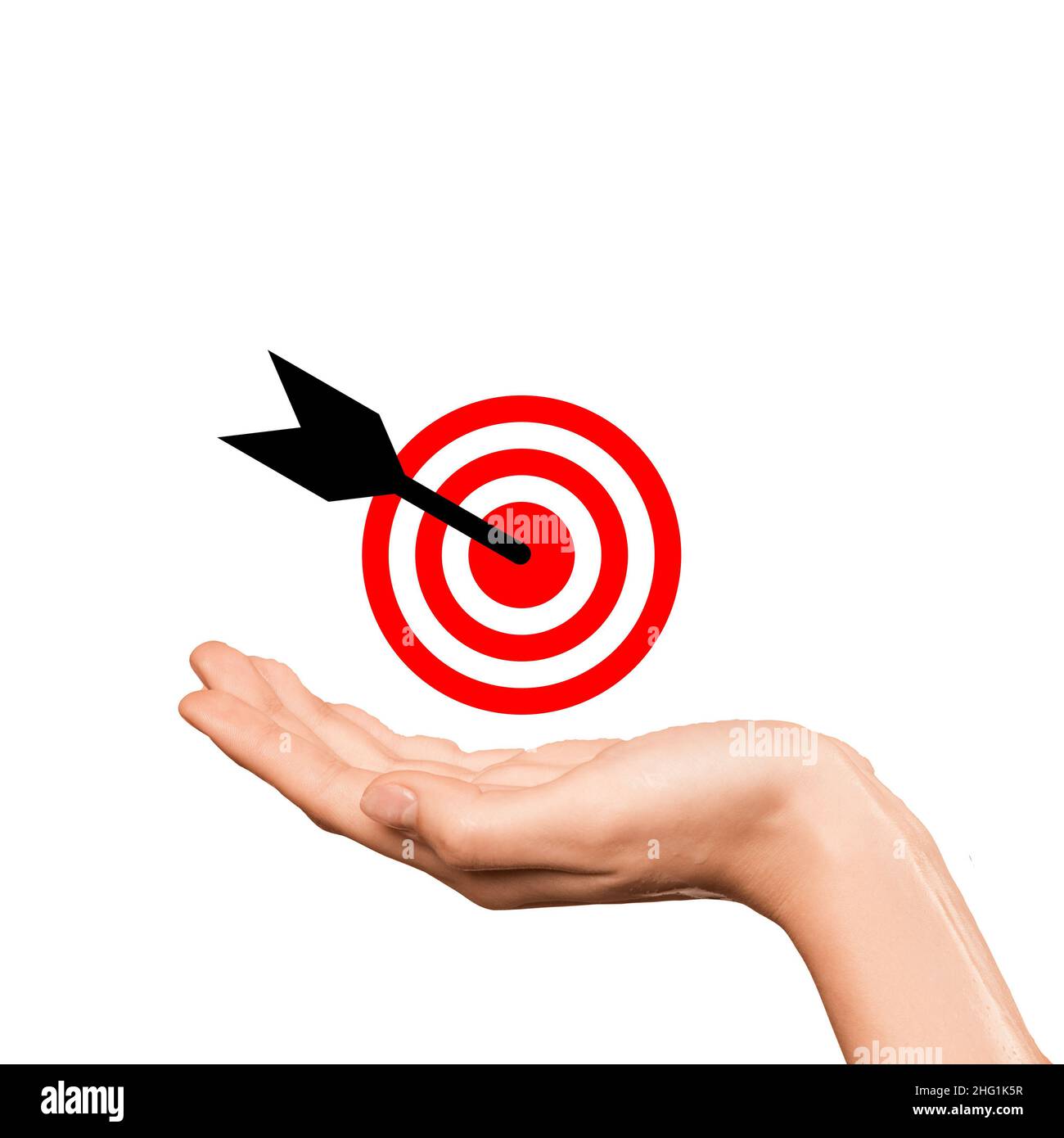 Mano con un obiettivo e una freccia al centro, che illustra il raggiungimento o il completamento di un obiettivo o obiettivo o obiettivo. Segno di successo. Foto Stock