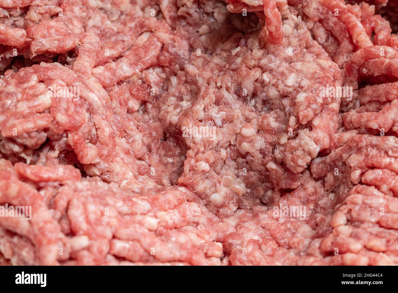 Carne di manzo appena macinata. Texture e sfondo di Mincemeat Foto Stock